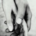 two hands touching intimately